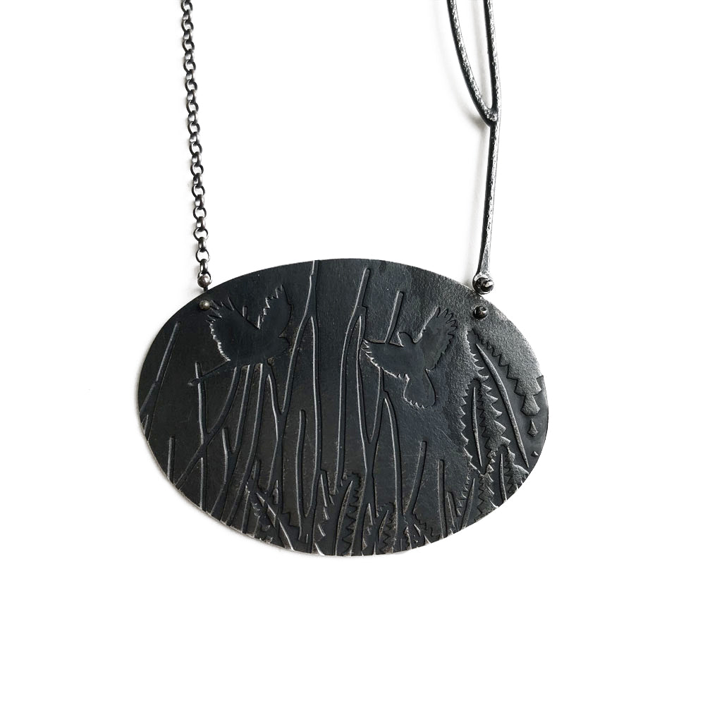 'Cockatoo with banksia leaf' pendant in oxidised sterling silver by Robin Wells