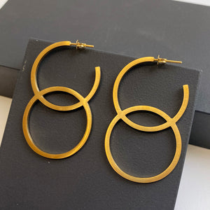 'Double Circle' earrings in gold by Melanie Katsalidis