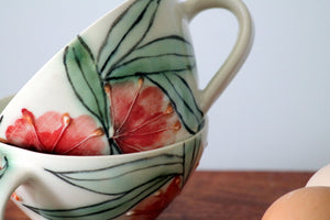 'Firewheel' porcelain teacup by Shannon Garson