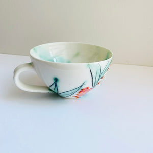 'Firewheel' porcelain teacup by Shannon Garson